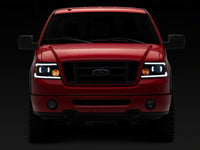 Raxiom 04-08 Ford F-150 Axial Series Projector Headlights with LED Bar- Black Housing- Clear Lens