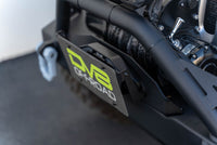 DV8 Offroad Fairlead Mounted Flip-Up License Plate Bracket