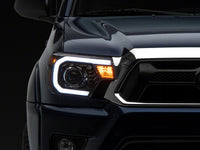 Raxiom 12-15 Toyota Tacoma Axial Projector Headlights w/ SEQL LED Bar- Blk Housing (Clear Lens)