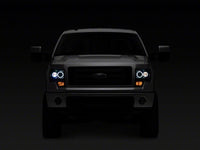 Raxiom 09-14 Ford F-150 Super White LED Halo Projector Headlights- Blk Housing (Clear Lens)