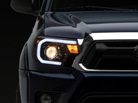 Raxiom 12-15 Toyota Tacoma Axial Projector Headlights w/ SEQL LED Bar- Blk Housing (Clear Lens)