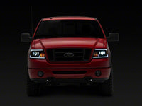 Raxiom 04-08 Ford F-150 Axial Series LED Proj Headlights/Seq LED Bar- Black- Clear Lens