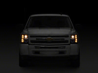 Raxiom 07-13 Chevrolet Silverado 1500 LED Halo Projector Headlights- Black Housing- Clear Lens